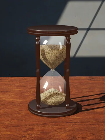 Glass hourglass in a walnut frame